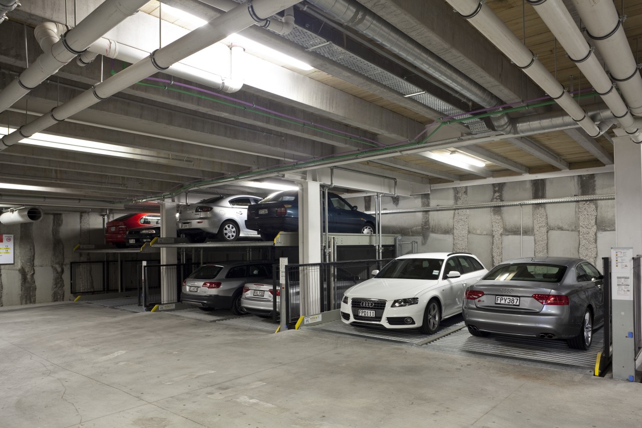 View of the underground car parking at the audi, automobile repair shop, automotive design, automotive exterior, building, car, executive car, family car, garage, luxury vehicle, motor vehicle, parking, parking lot, personal luxury car, vehicle, gray, black