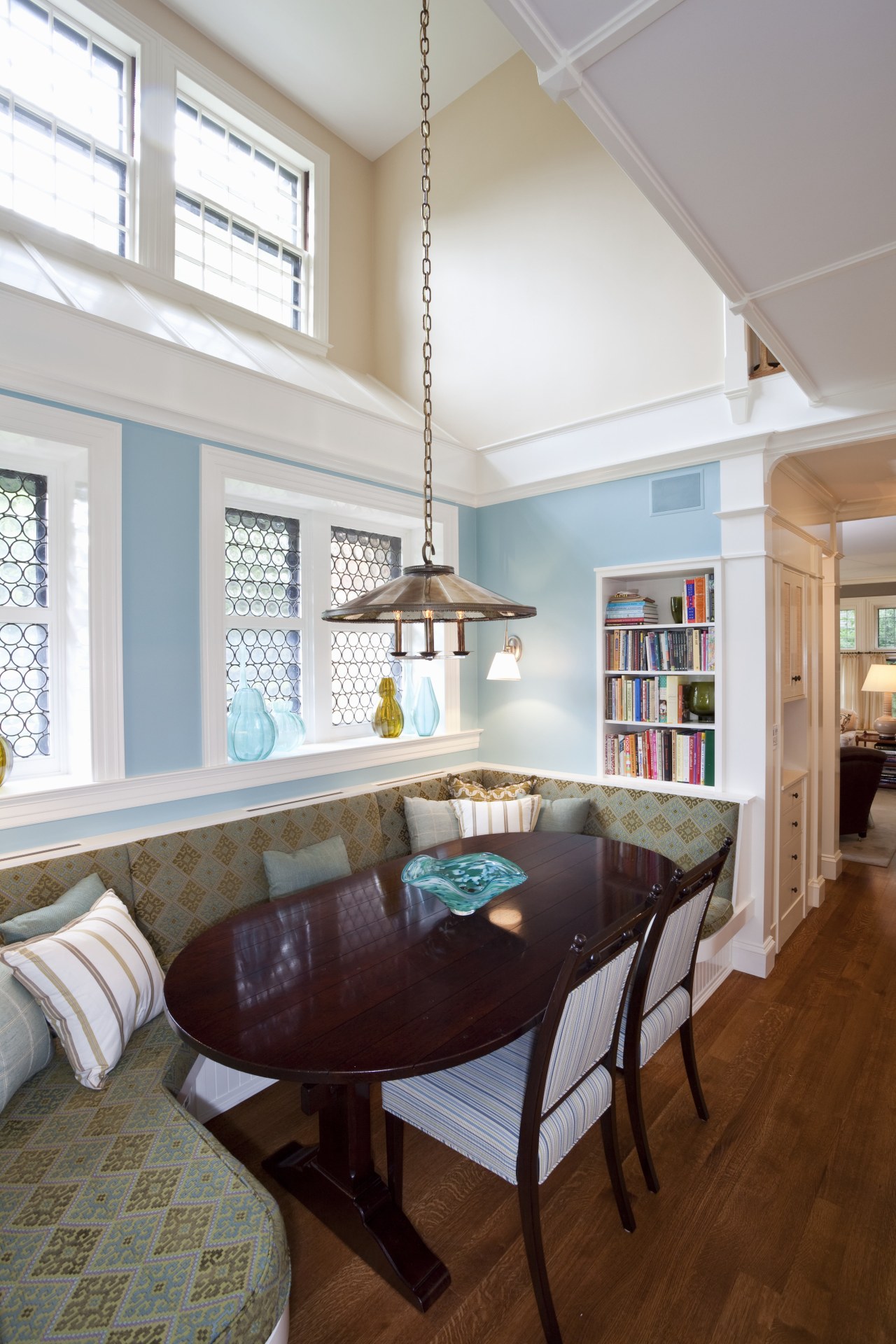 View of kitchen with dark turquoise island, colorful ceiling, dining room, floor, hardwood, home, interior design, living room, real estate, room, table, window, wood flooring, gray