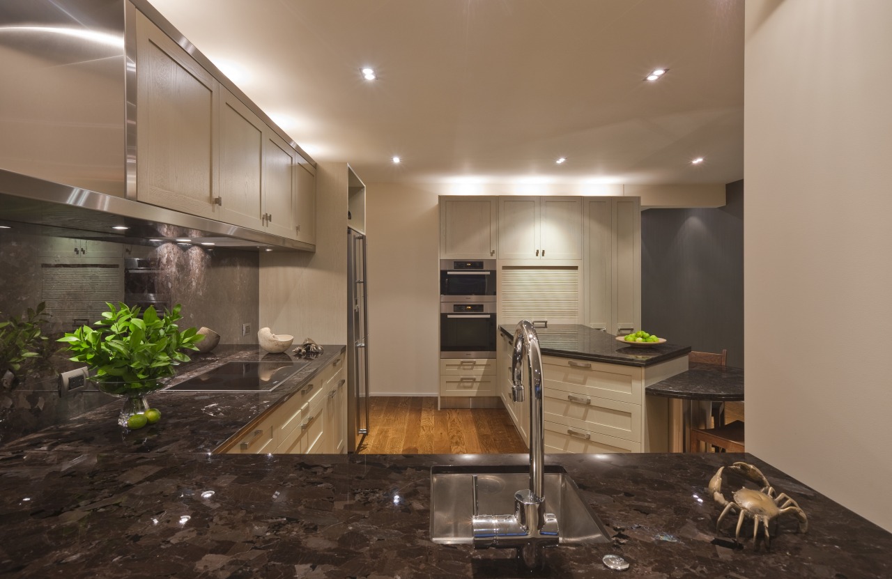 View of a kitchen which features timber floors, ceiling, countertop, flooring, interior design, kitchen, real estate, brown