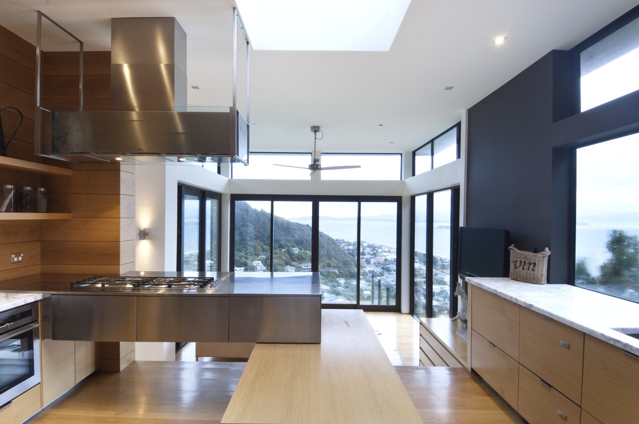 View of kitchen which features oak floors, and architecture, countertop, daylighting, interior design, kitchen, real estate, white, brown