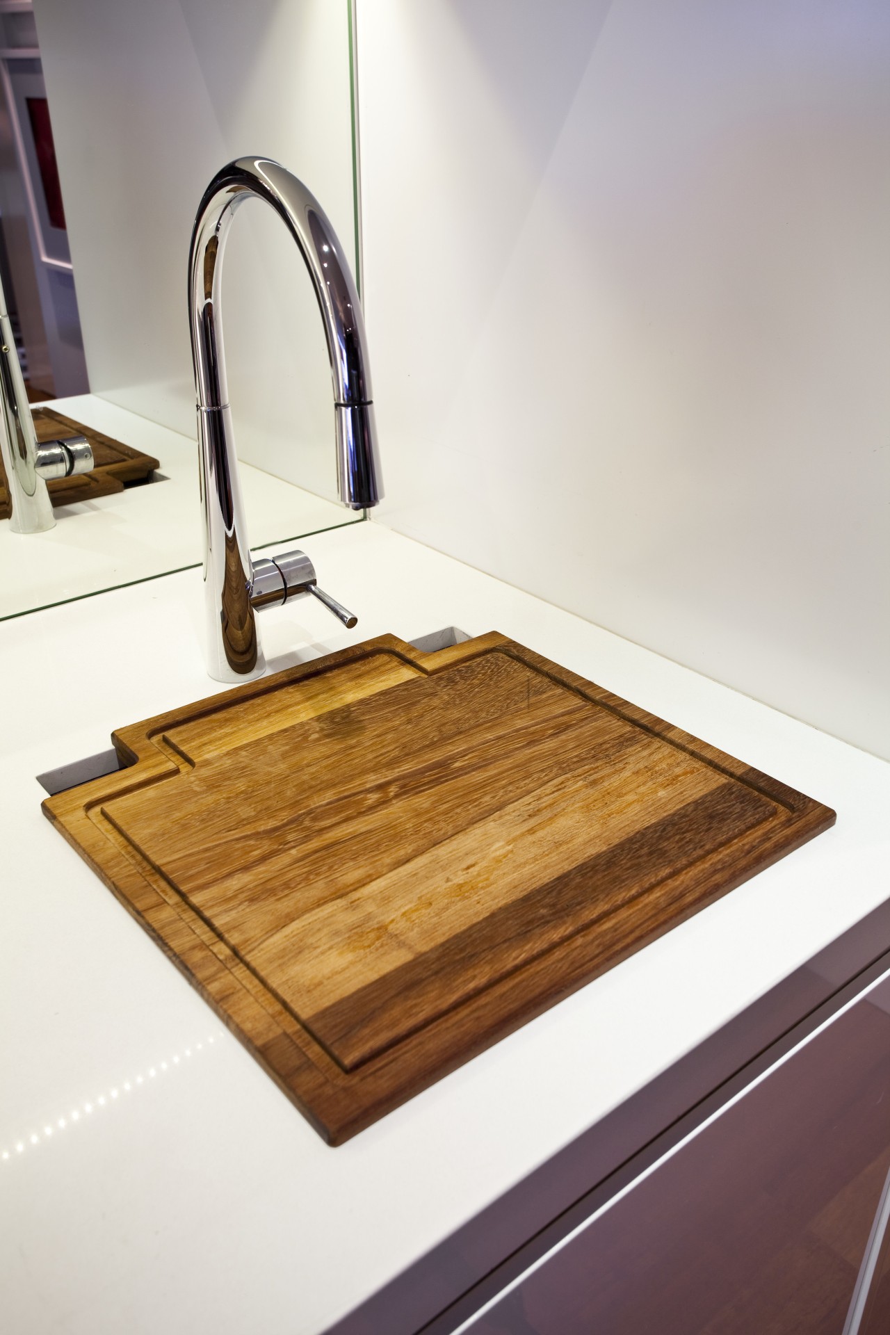 View of a kitchen which features a Smeg countertop, floor, flooring, plumbing fixture, product design, sink, tap, wood, white