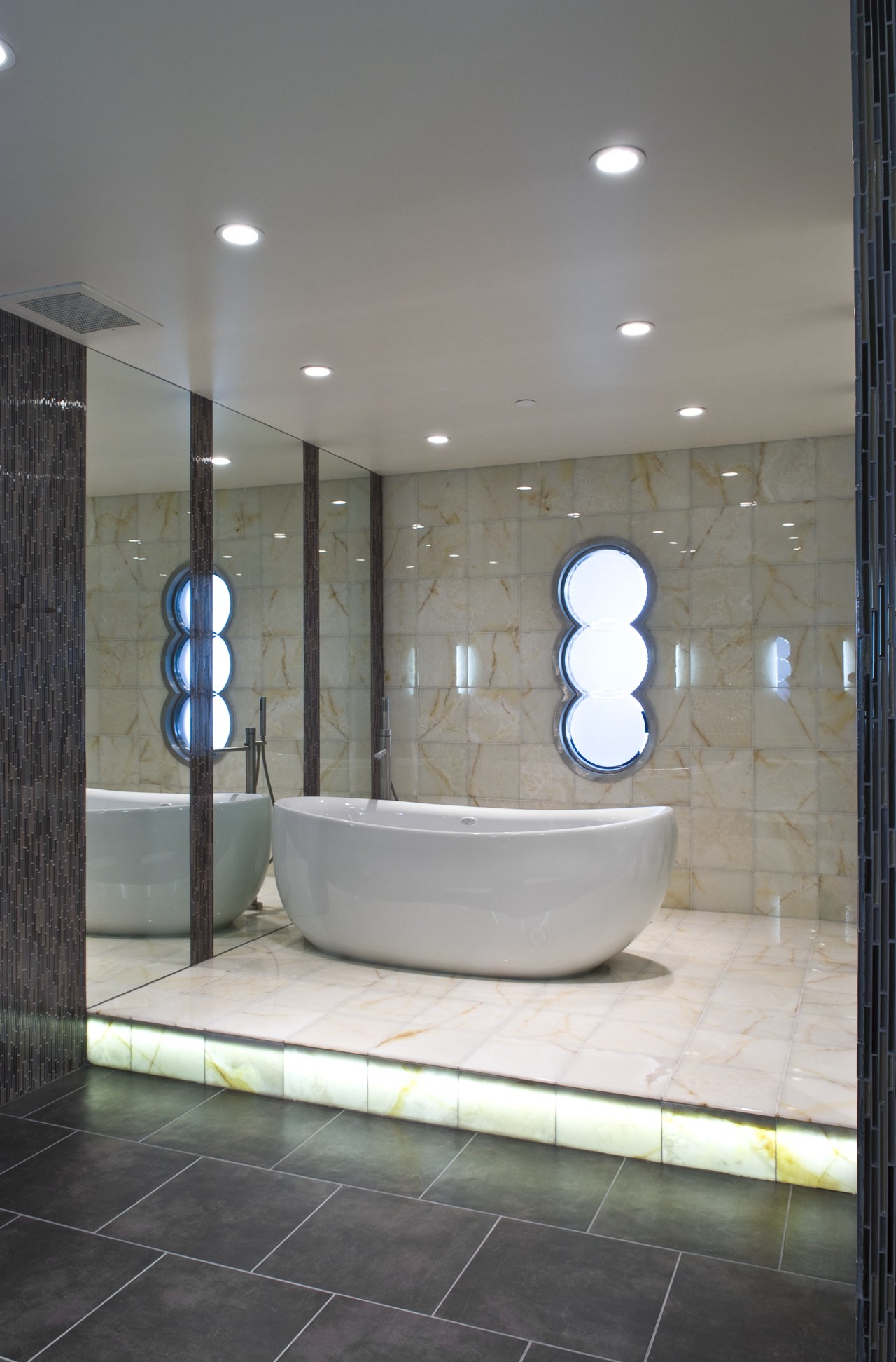 View of bathroom at the Pececnik apartment which architecture, bathroom, ceiling, daylighting, floor, flooring, glass, interior design, plumbing fixture, room, tile, gray