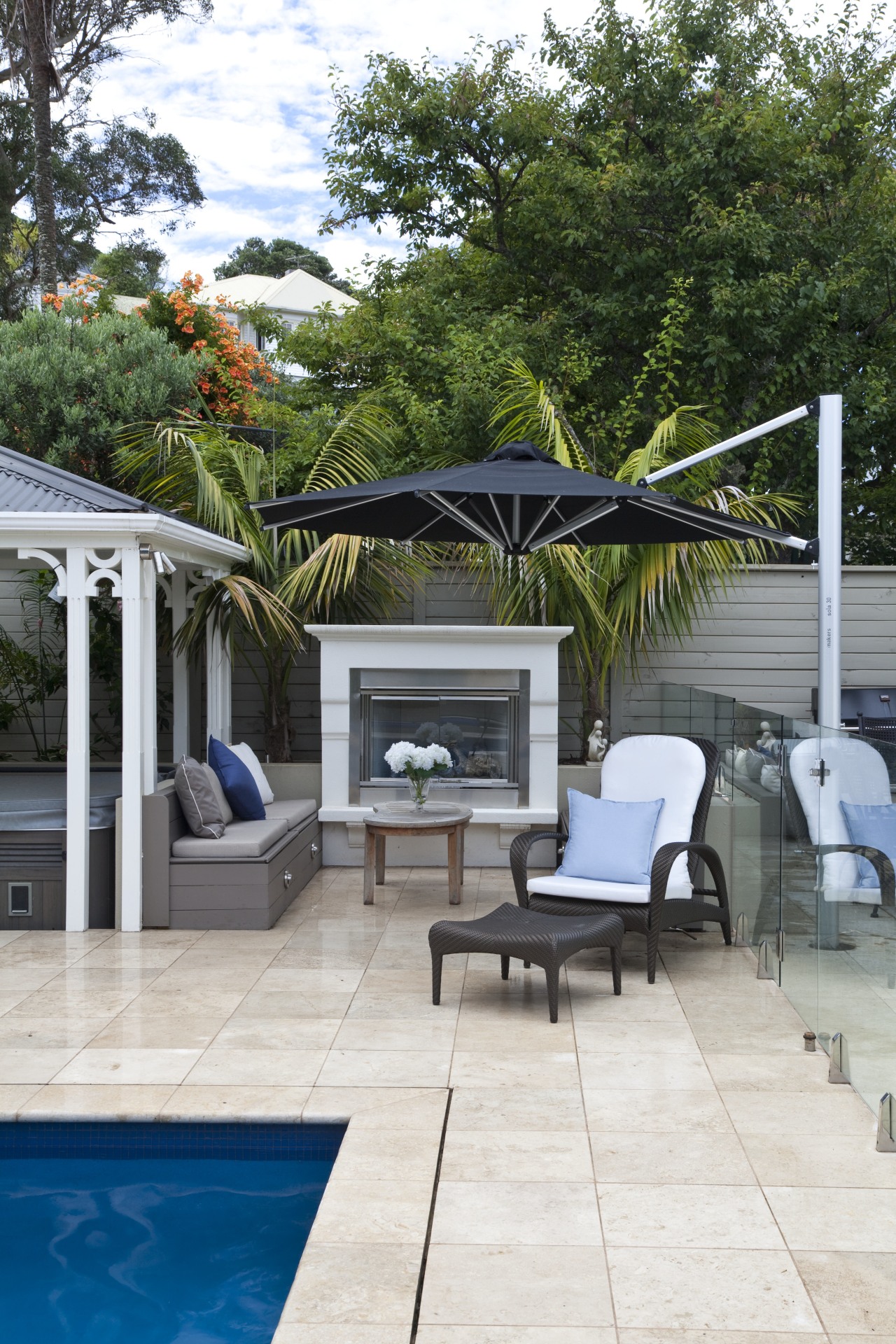 View of outdoor area with pool, paving, fountain, backyard, home, house, outdoor furniture, outdoor structure, patio, real estate, sunlounger, swimming pool, white