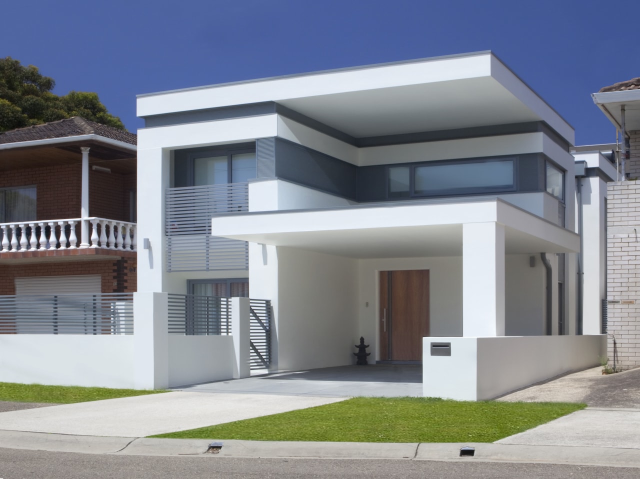 View of contemporary white home. architecture, building, elevation, estate, facade, home, house, official residence, property, real estate, residential area, gray