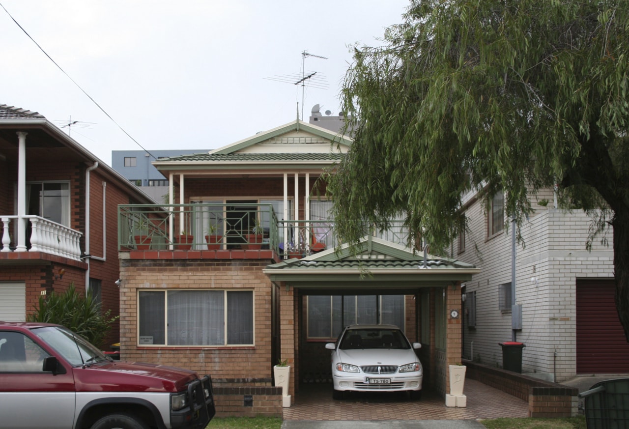 Before picture of a house. building, car, facade, family car, home, house, luxury vehicle, neighbourhood, property, real estate, residential area, roof, sedan, suburb, vehicle