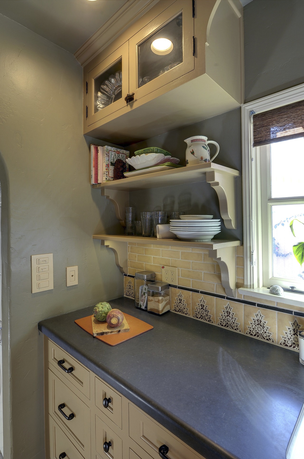 View of Spanish-style home with open shelving and cabinetry, countertop, furniture, home, house, interior design, kitchen, room, shelf, wall, brown, gray