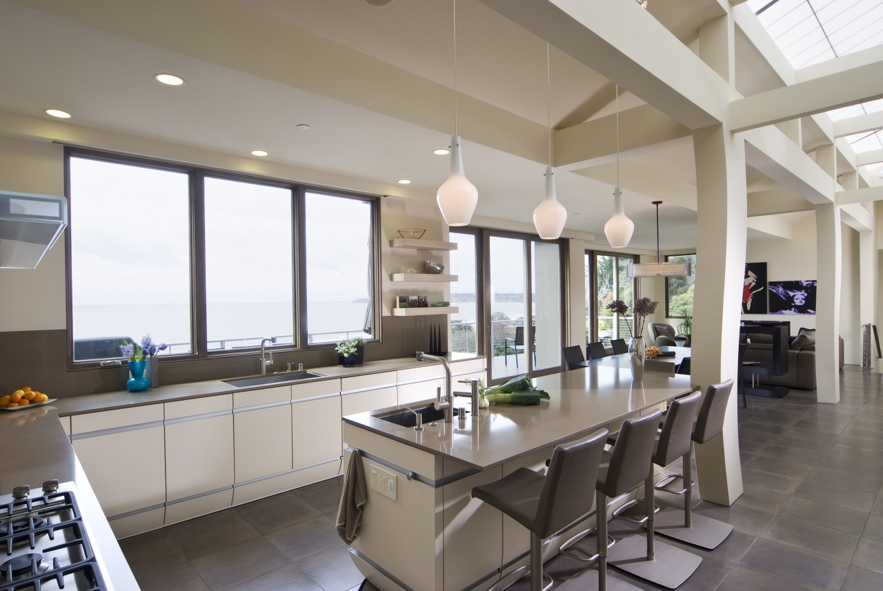 View of neutral-toned kitchen and dining space, featuring countertop, interior design, kitchen, property, real estate, window, gray