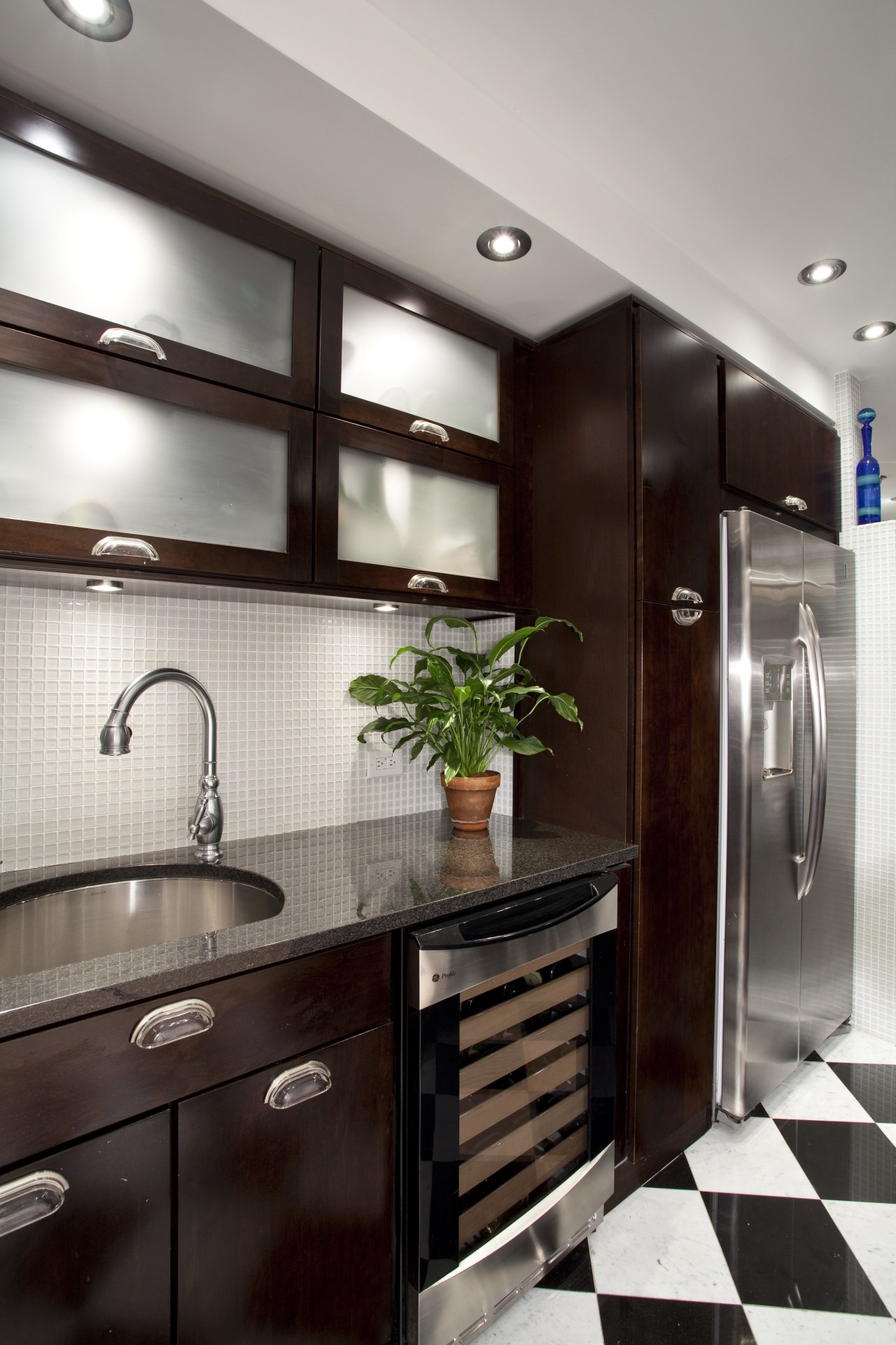 View of kitchen in Art-Deco styled apartment building, cabinetry, countertop, home appliance, interior design, kitchen, gray, black