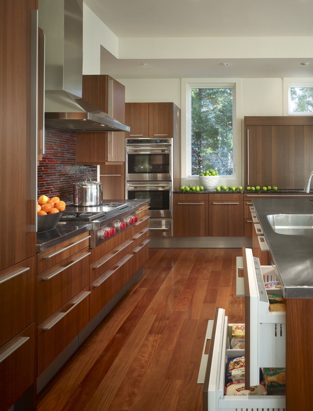 View of a kitchen which combines commerical touches cabinetry, countertop, cuisine classique, floor, flooring, hardwood, interior design, kitchen, laminate flooring, real estate, room, wood, wood flooring, brown, gray