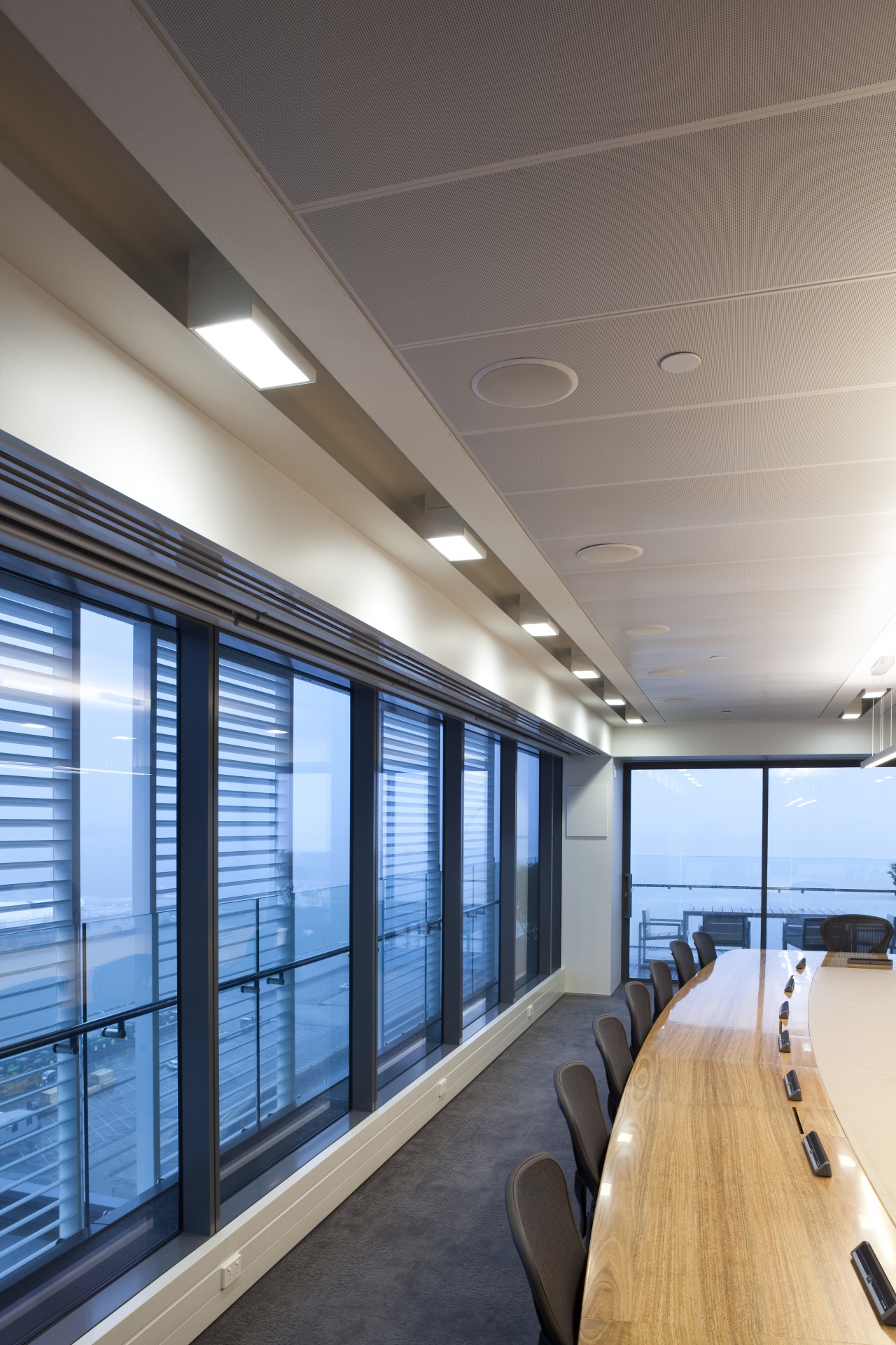 View of boardroom with dark carpet. architecture, ceiling, daylighting, glass, interior design, office, wall, window, gray