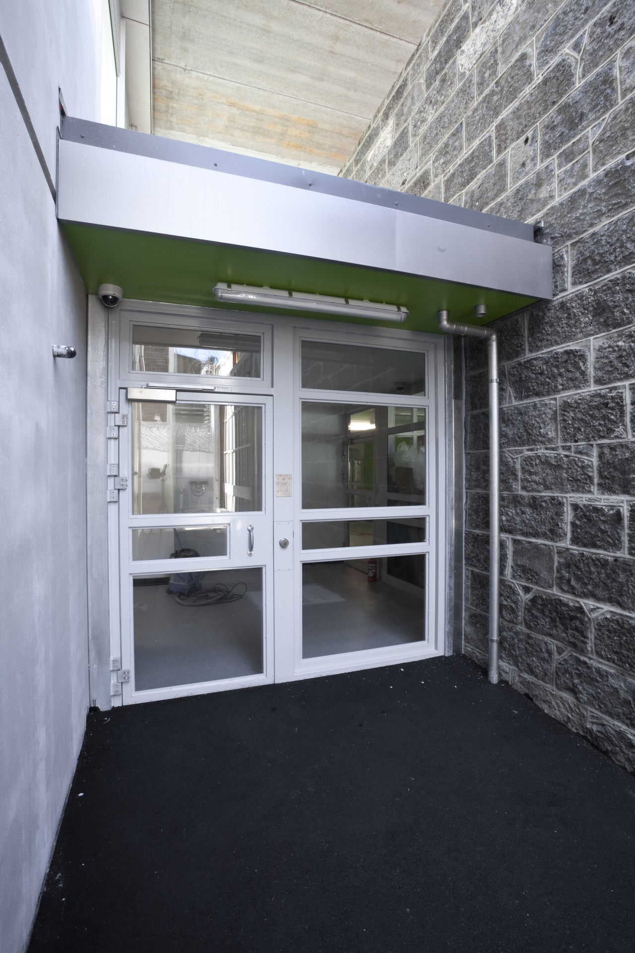 View of windows at Mt Eden prison by architecture, door, house, window, gray, black