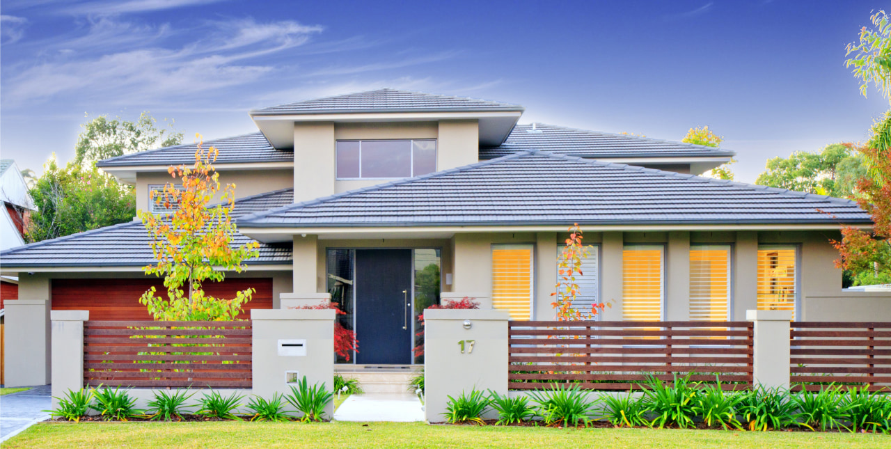 Contemporary home. Oppidan Homes. Director Steven Gild.  architecture, cottage, elevation, estate, facade, grass, home, house, neighbourhood, outdoor structure, plant, property, real estate, residential area, roof, sky, tree, blue
