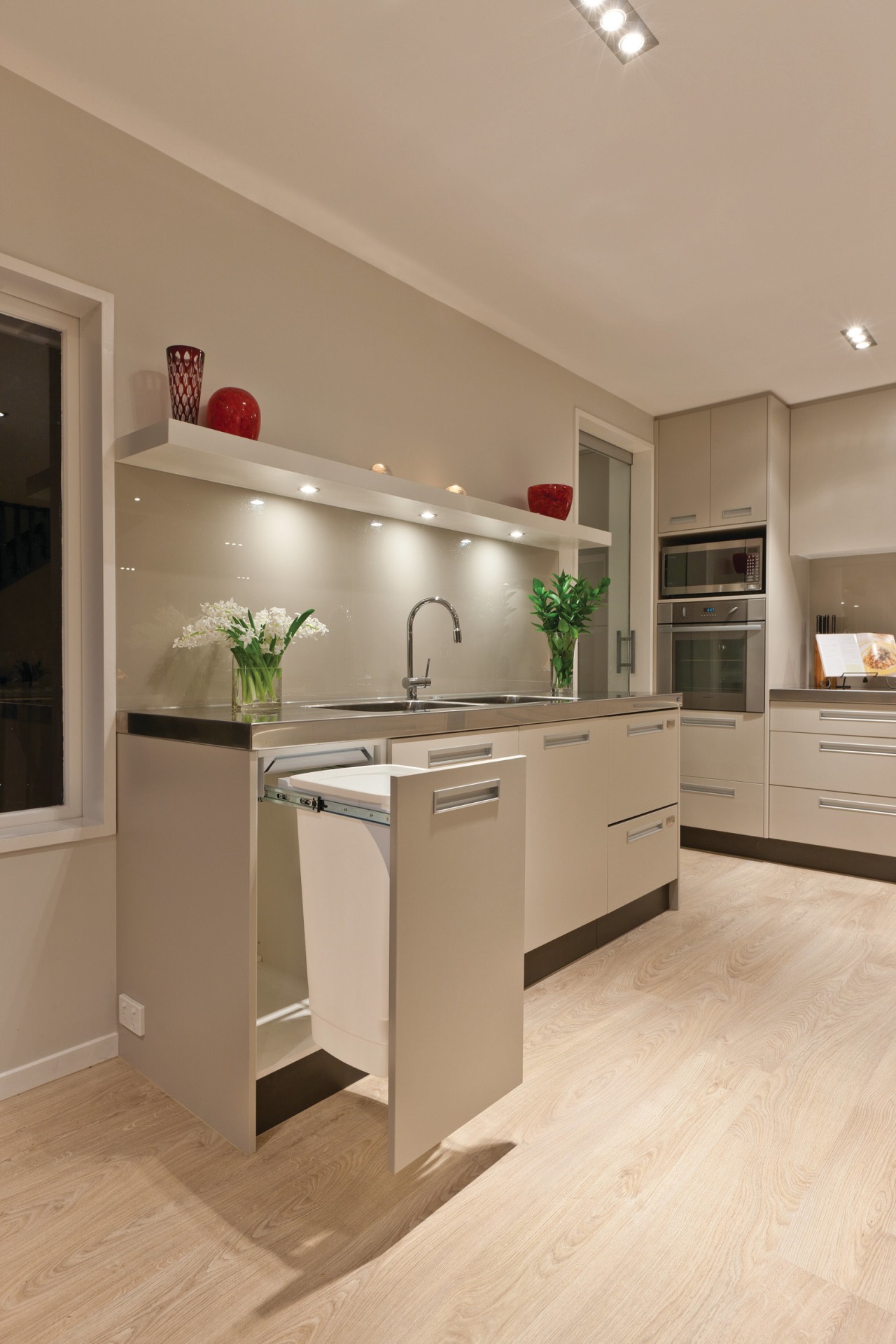 A kitchen featuring Kitchen King's Hideaway Bins. cabinetry, countertop, cuisine classique, floor, flooring, hardwood, home appliance, interior design, kitchen, laminate flooring, room, wood flooring, orange, brown