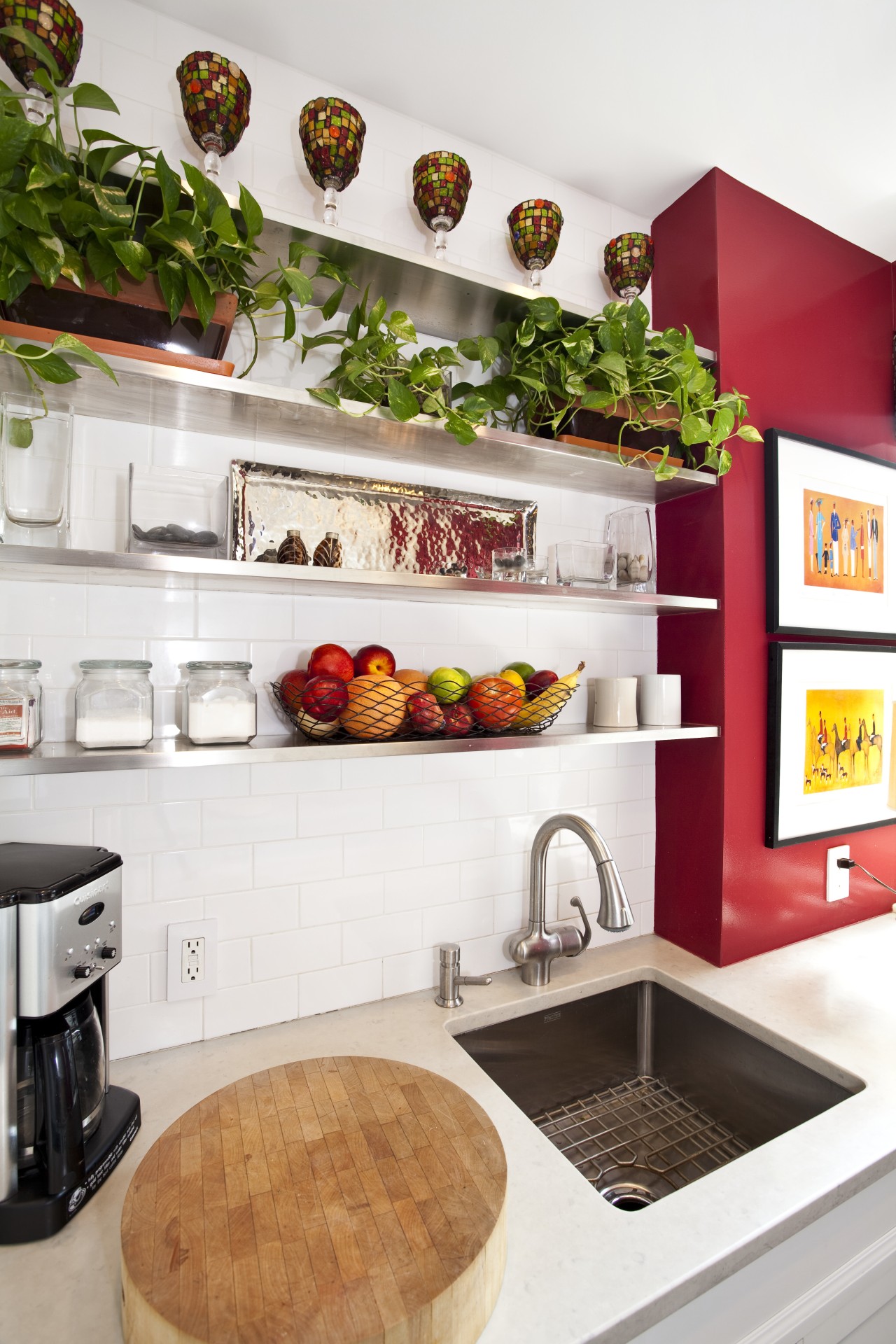 Black porcelain floor tiles. Red accenting walls. Carra countertop, home appliance, interior design, kitchen, shelf, white