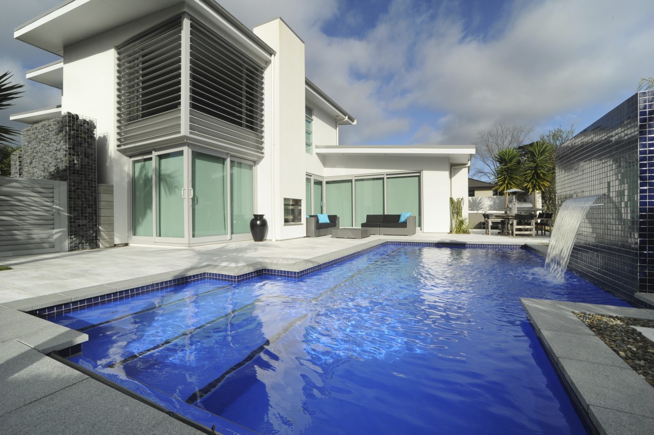 A new pool, by Mayfair pools, featuring a architecture, estate, home, house, property, real estate, swimming pool, villa, gray, blue