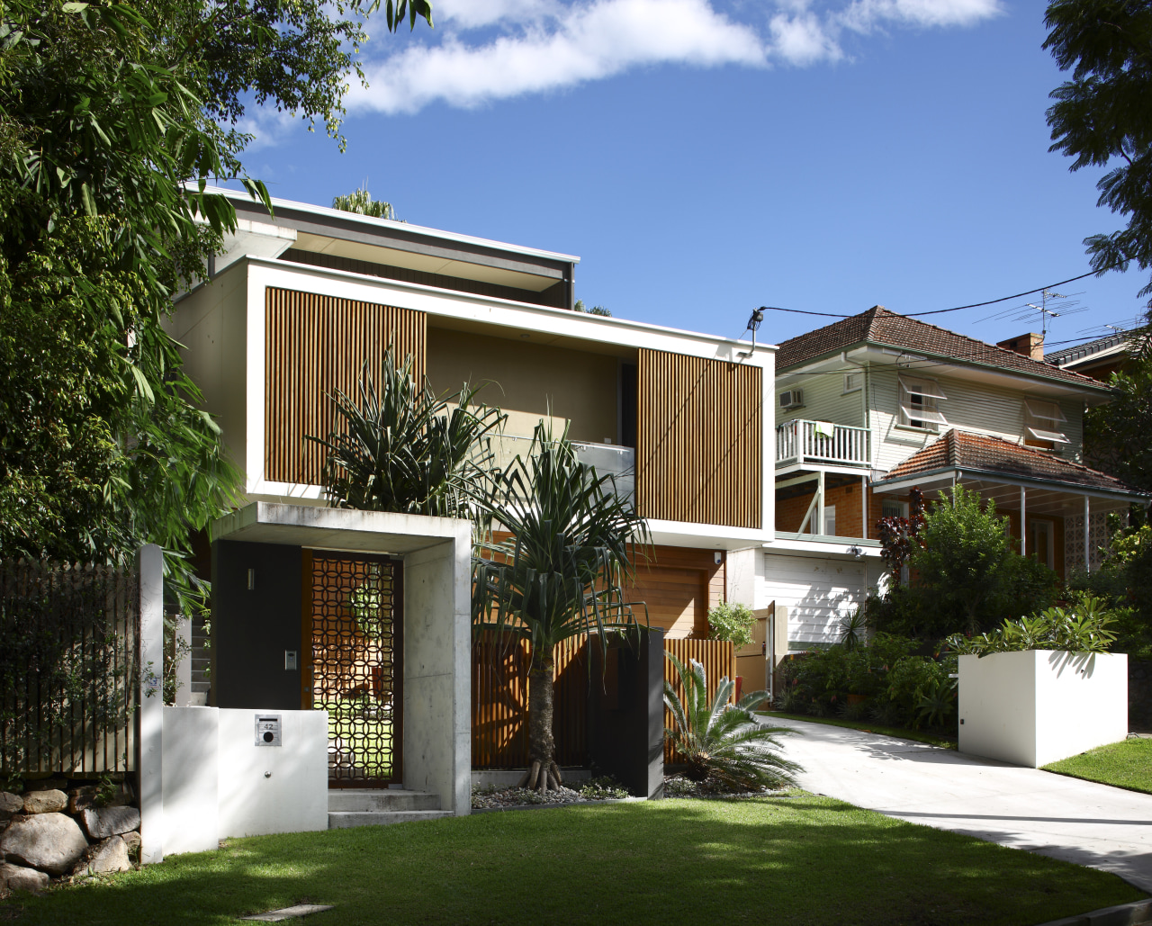 This house was designed by Kon Panagopoulos and architecture, backyard, cottage, courtyard, elevation, estate, facade, home, house, neighbourhood, property, real estate, residential area, villa