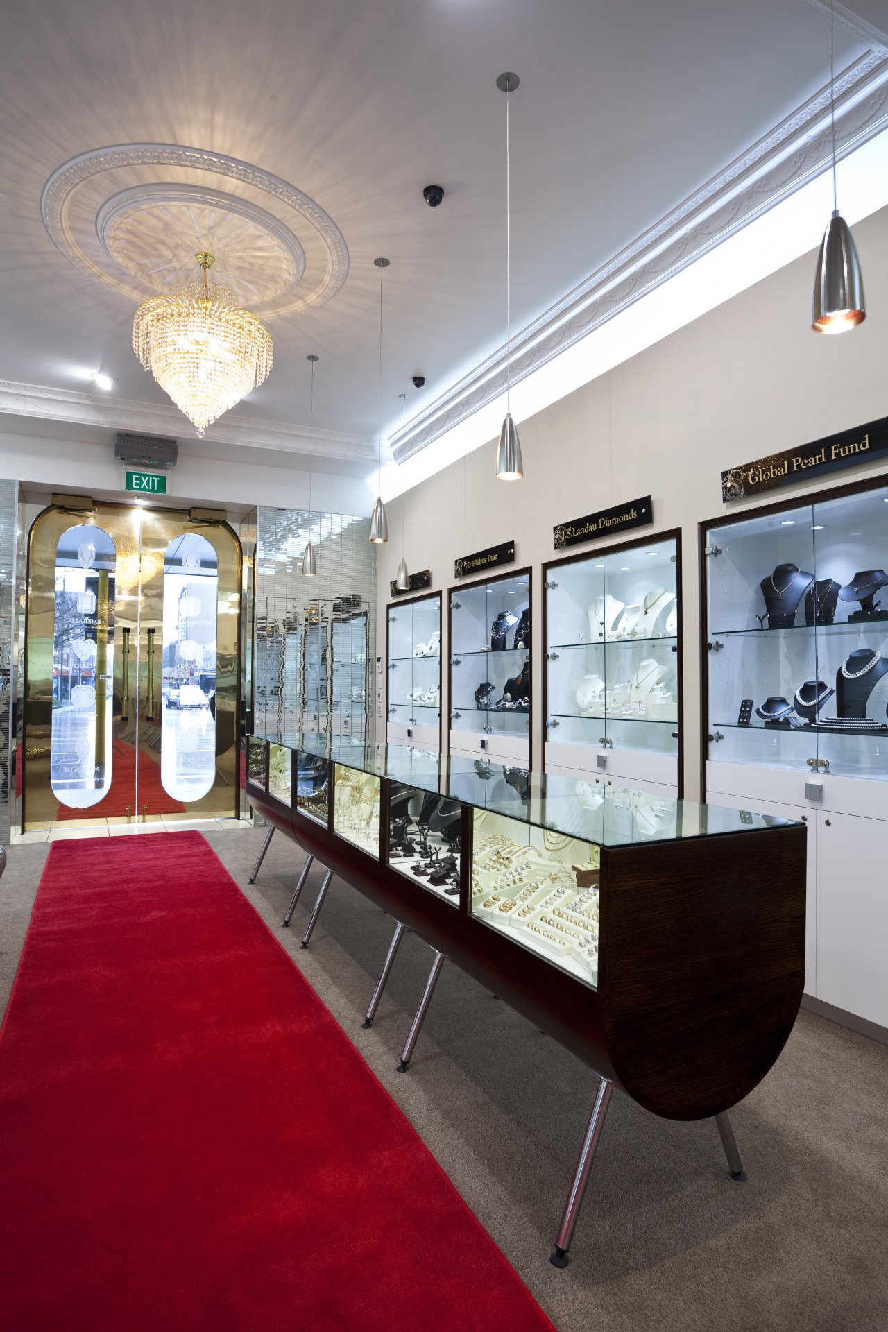 View of the Anna Webster Jeweler boutique.Features repeating ceiling, interior design, lobby, gray