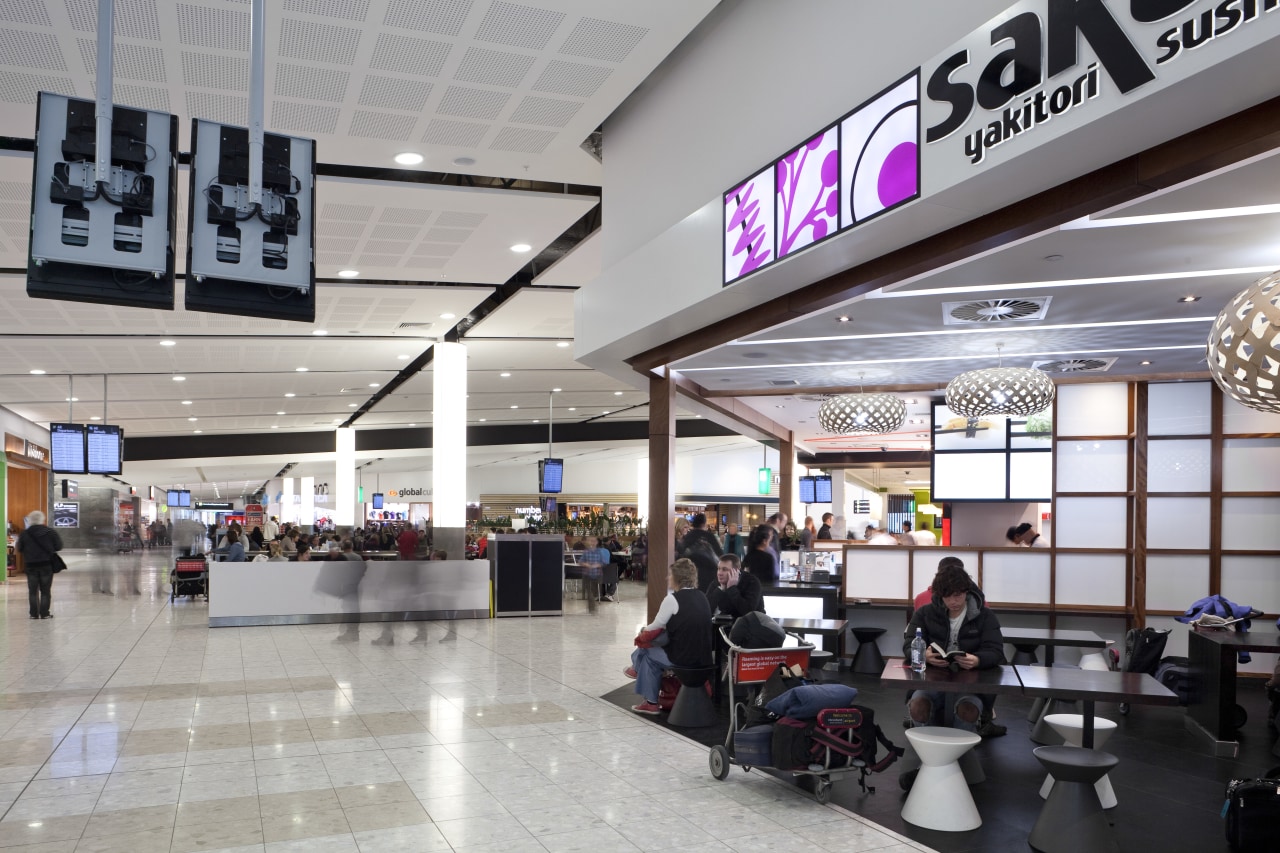 View of the interior of Christchurch Airport. airport terminal, outlet store, retail, shopping mall, gray