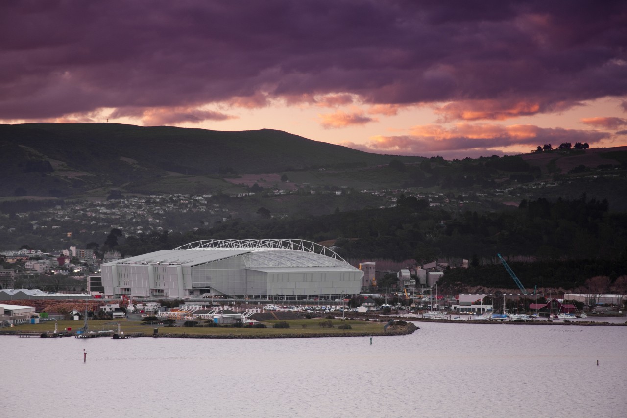 View of Forsyth Bar Stadium in Dunedin. By city, cloud, dawn, dusk, evening, horizon, loch, morning, sea, sky, structure, sunset, water, black, gray