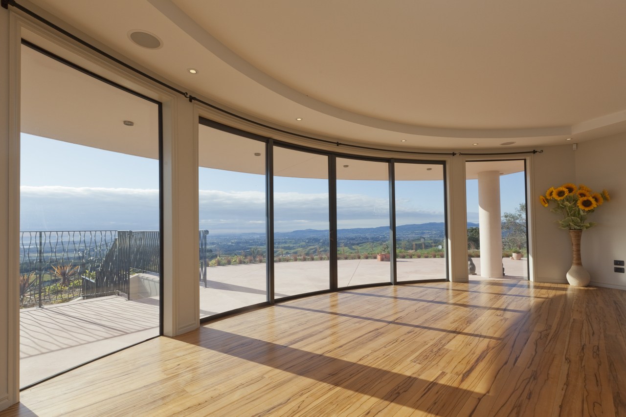 These windows were created with Glasshape's new curved apartment, daylighting, door, estate, floor, flooring, hardwood, home, house, interior design, penthouse apartment, property, real estate, window, wood, wood flooring, brown, orange