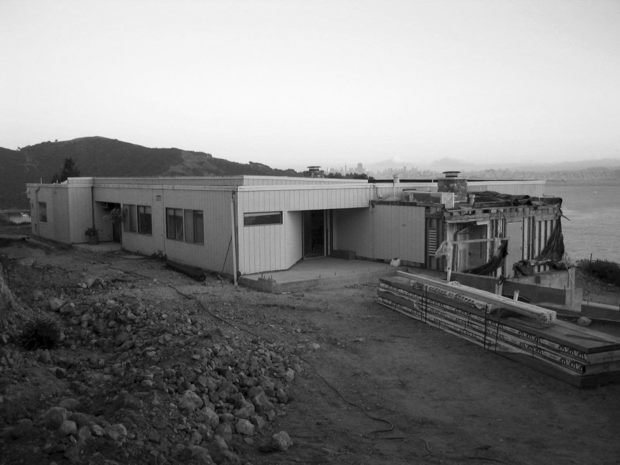 This house was remodeled by Robert Swatt of black and white, house, monochrome, monochrome photography, shack, sky, black, white