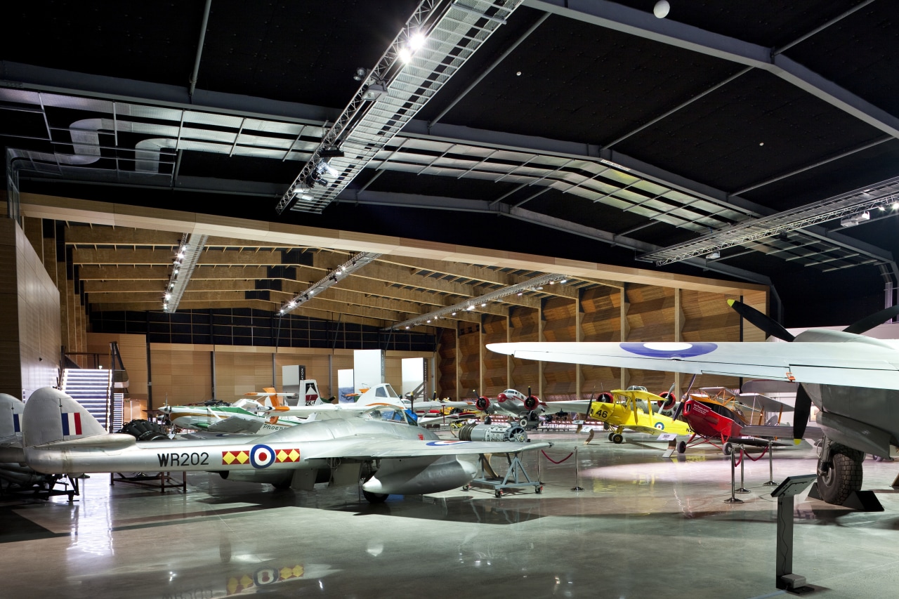 Here is a view of MOTAT's Arviation Display architecture, automotive design, car, hangar, black, gray