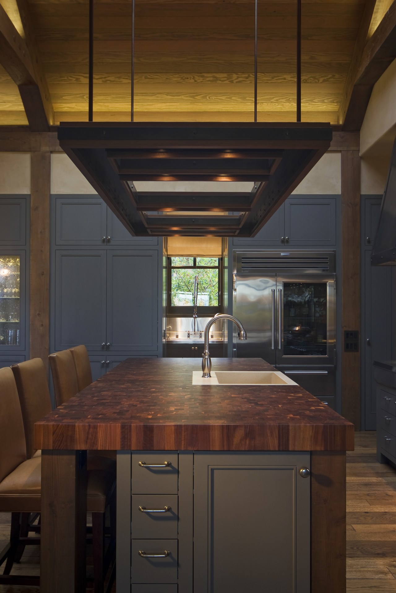 View of kitchen, great room and wine cellar. architecture, cabinetry, ceiling, countertop, cuisine classique, daylighting, home, interior design, kitchen, lighting, under cabinet lighting, wood, brown, black