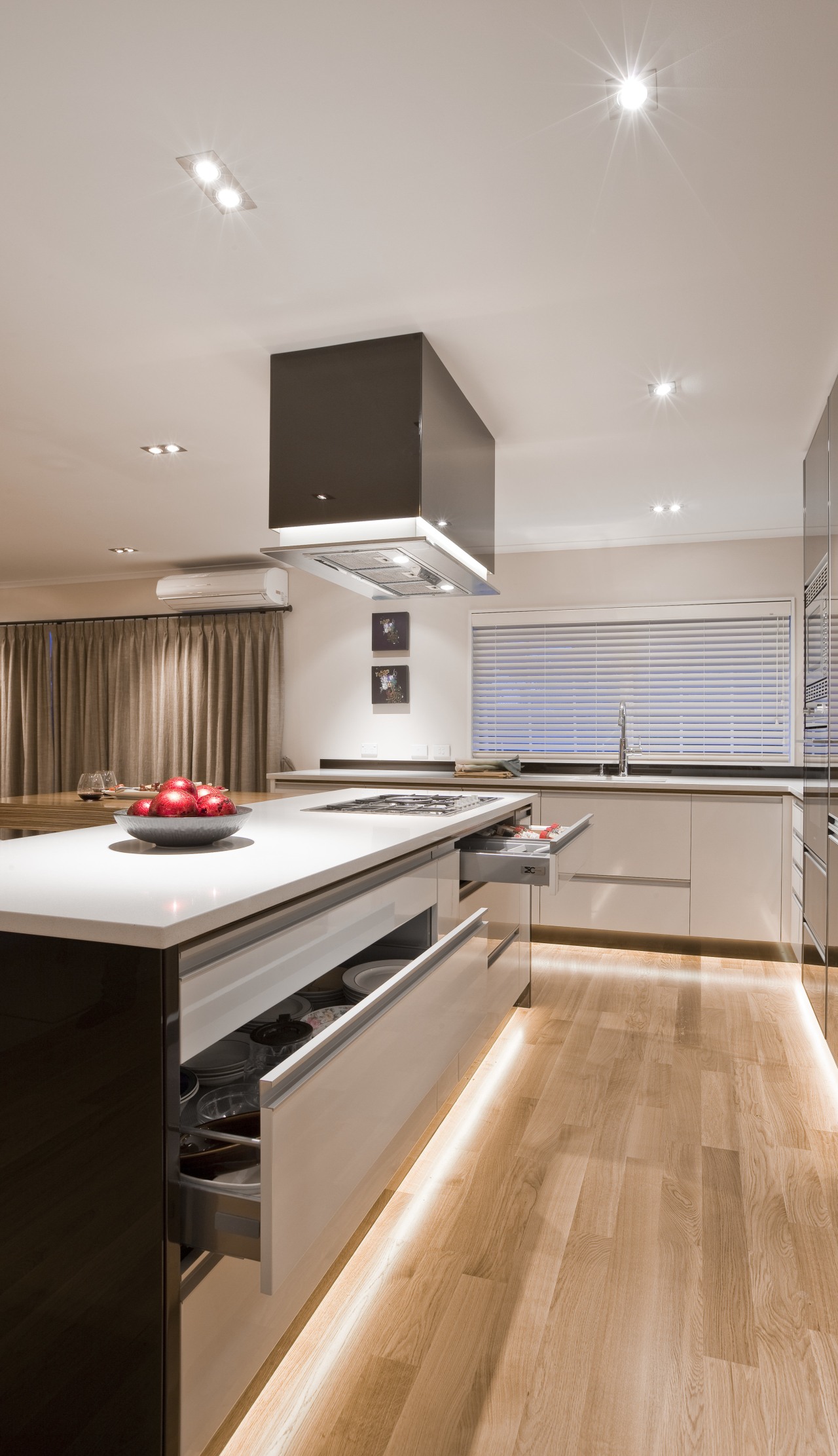 View of kitchen. Warm chocolare toens contrast with cabinetry, countertop, cuisine classique, floor, flooring, hardwood, interior design, kitchen, laminate flooring, room, wood, wood flooring, gray