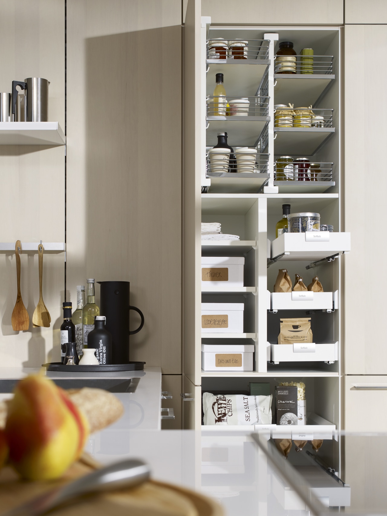 Photography of the "FloatingSpaces" system by SieMatic. countertop, furniture, kitchen, refrigerator, shelf, shelving, white