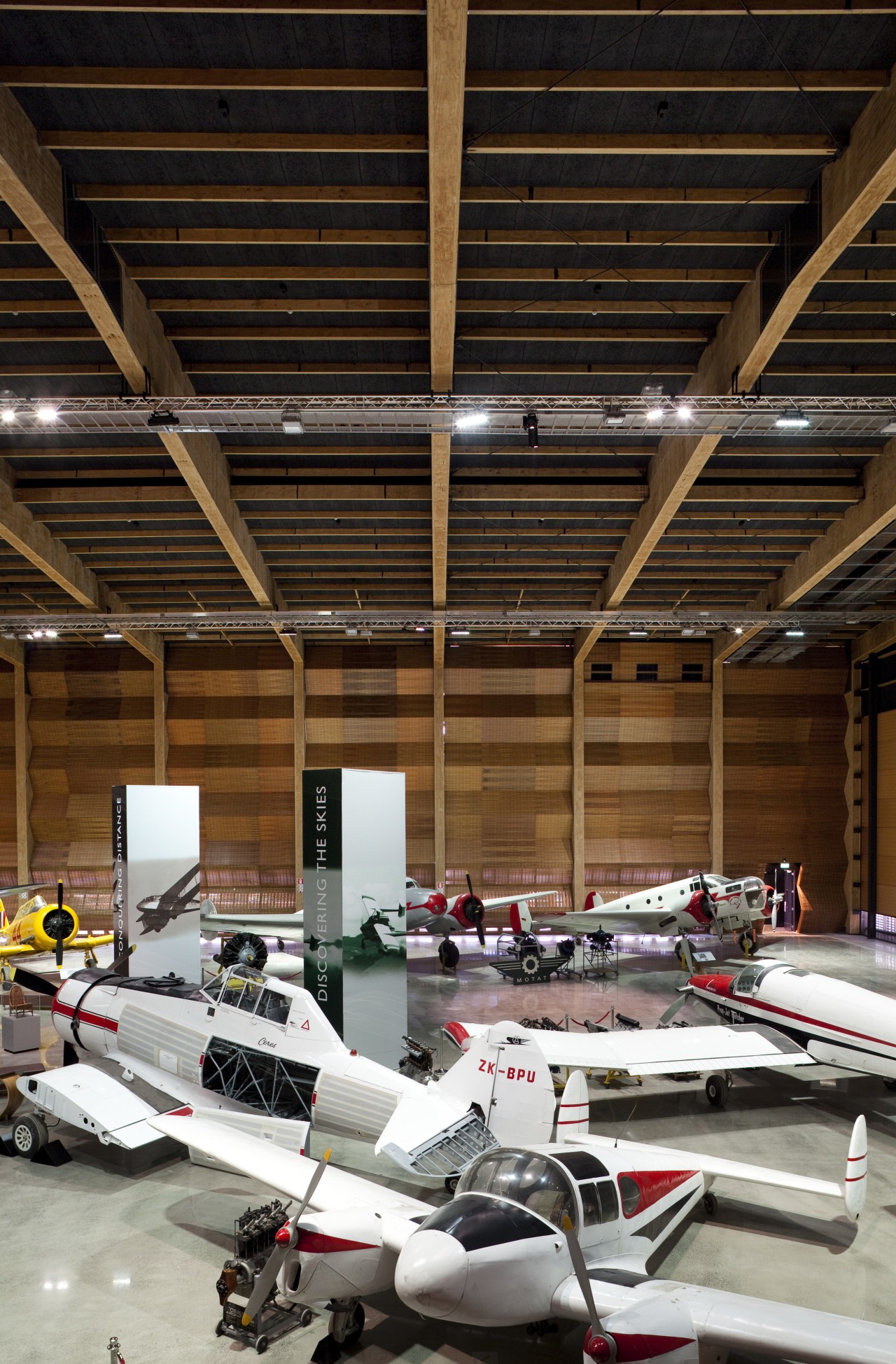 The timber for this MOTAT Aviation Display Hall aerospace engineering, aviation, car, hangar, brown, black