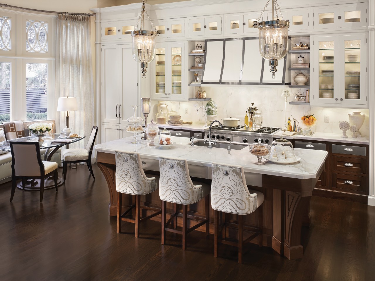 View of kitchen with dark wooden flooring and cabinetry, countertop, cuisine classique, dining room, floor, flooring, furniture, interior design, kitchen, room, table, wood flooring, white, brown