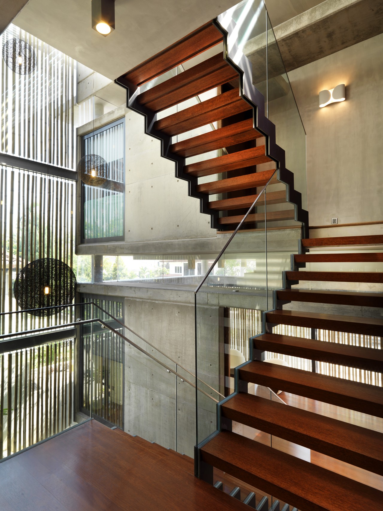 This home was designed with environmental principals in architecture, baluster, daylighting, estate, handrail, interior design, lobby, real estate, stairs