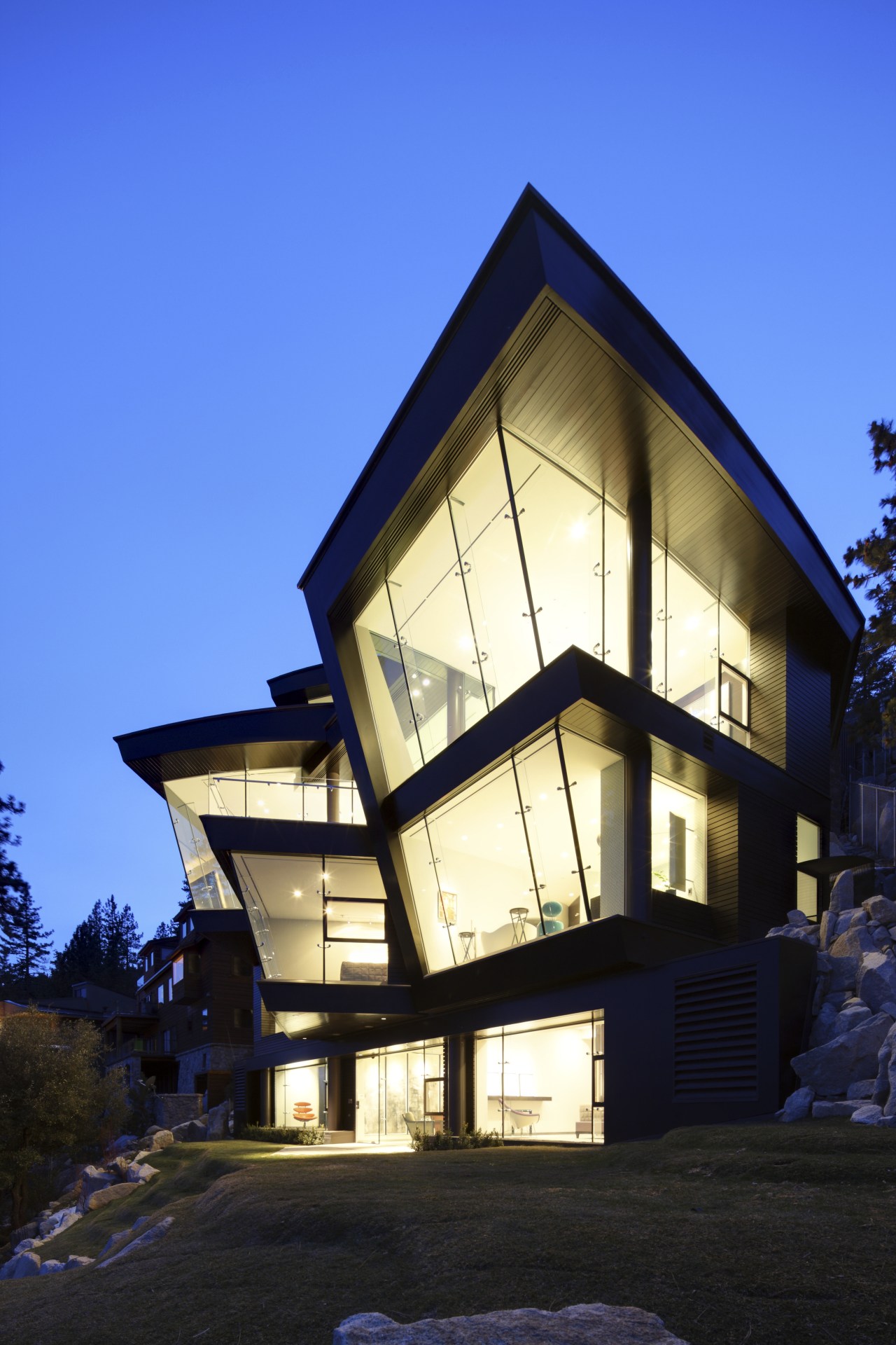 This home's interior was designed by James Laney architecture, building, cottage, evening, facade, home, house, property, real estate, residential area, sky, window, blue