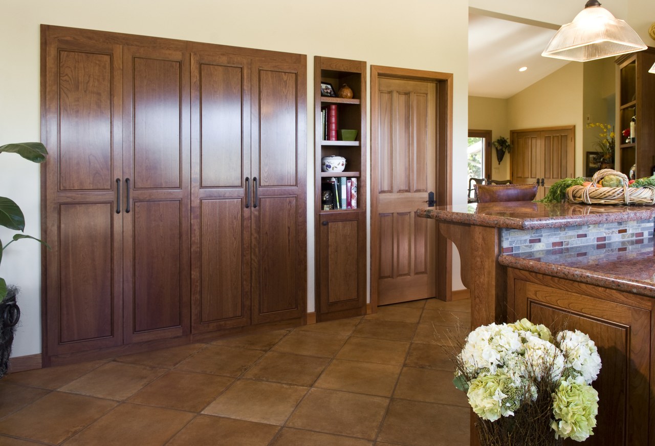 View of kitchen with wooden flooring and island cabinetry, countertop, door, floor, flooring, hardwood, home, interior design, kitchen, real estate, room, wood, wood flooring, brown