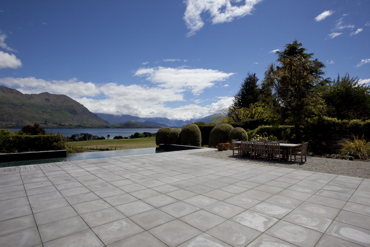 View of outdoor dining area with table and architecture, cloud, estate, house, landscape, mountain, plant, property, real estate, roof, sky, tree, gray