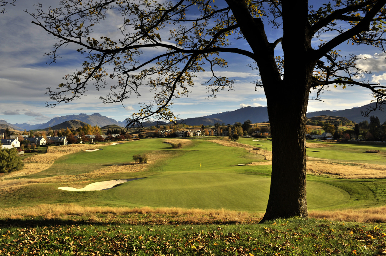 Here is a view of Millbrook Country Club golf club, golf course, grass, landscape, sky, tree, brown