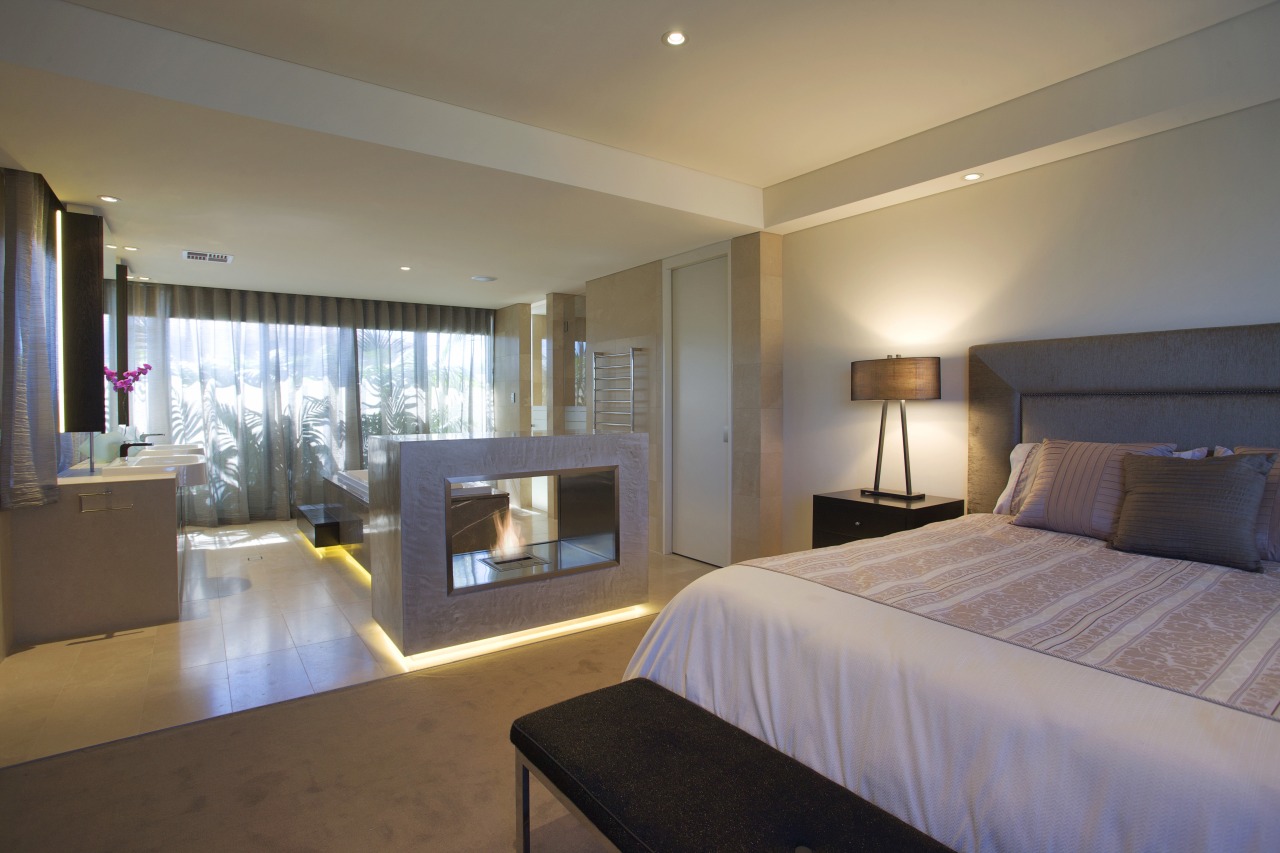 Bedroom with white patterned bedspread and low lighting. architecture, bedroom, ceiling, hotel, interior design, real estate, room, suite, gray, brown