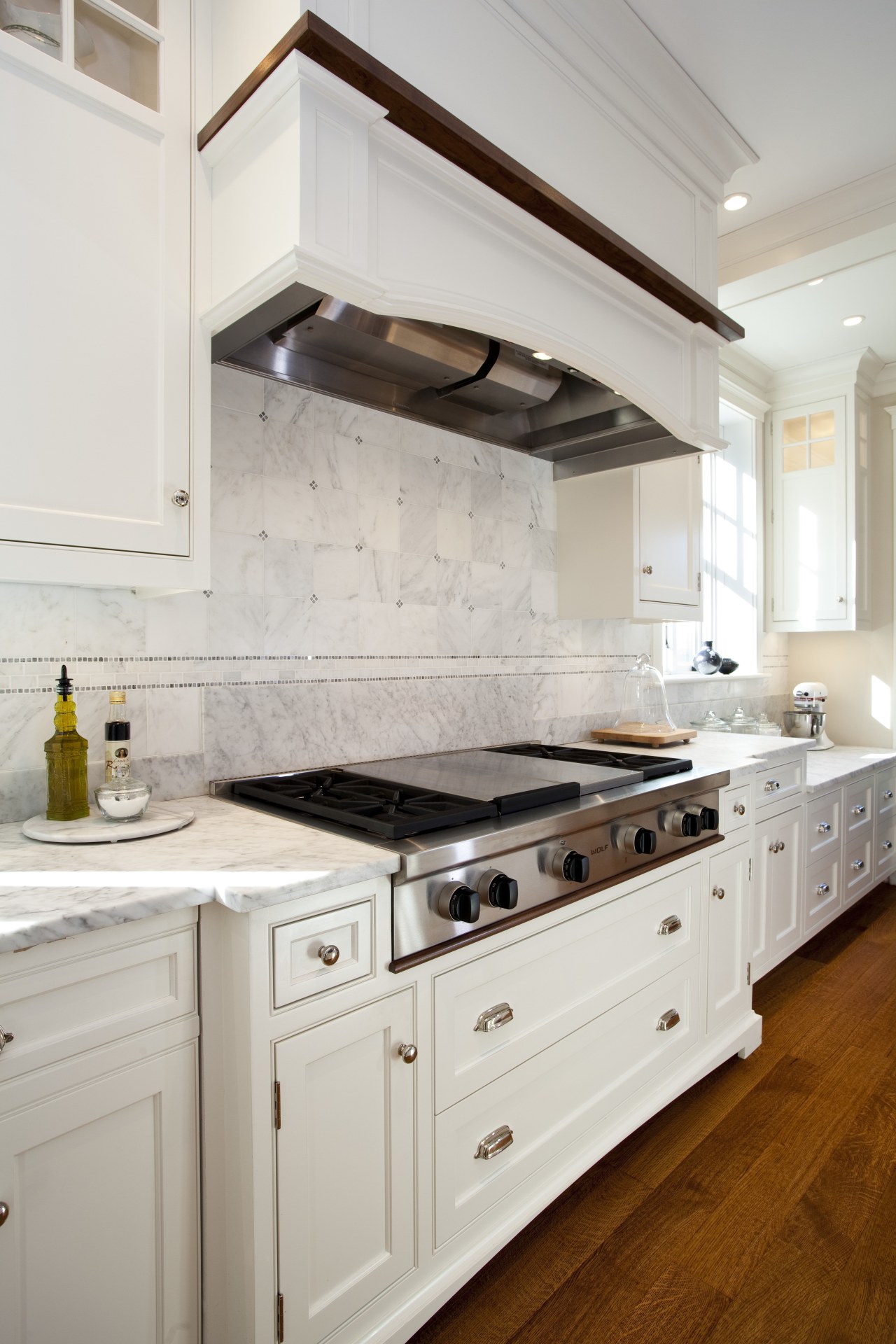 View of kitchen with white cabinetry and wooden cabinetry, countertop, cuisine classique, floor, flooring, home, interior design, kitchen, room, gray