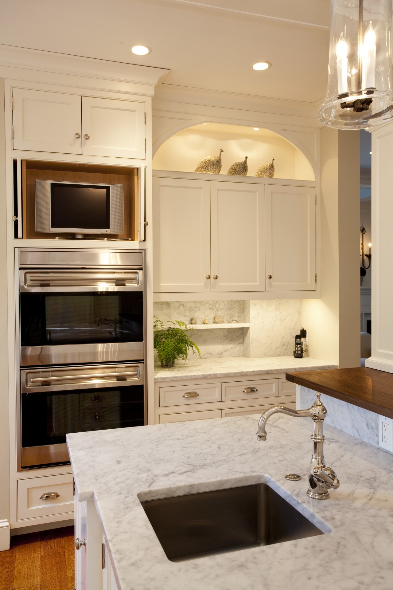 View of kitchen with white cabinetry and wooden cabinetry, countertop, cuisine classique, floor, home appliance, interior design, kitchen, room, orange, gray