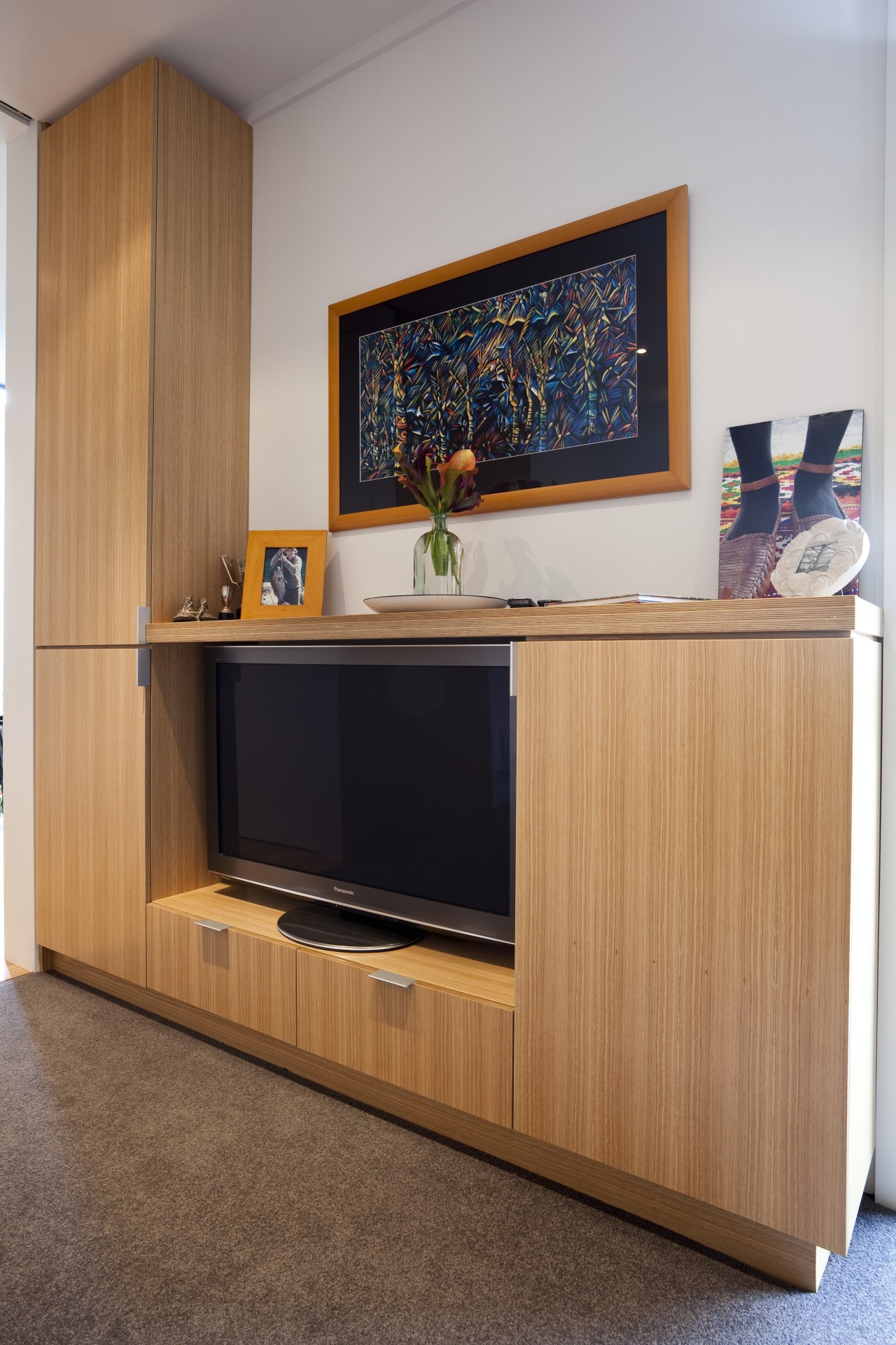 View of wooden TV cabinet. cabinetry, furniture, interior design, gray, orange, brown