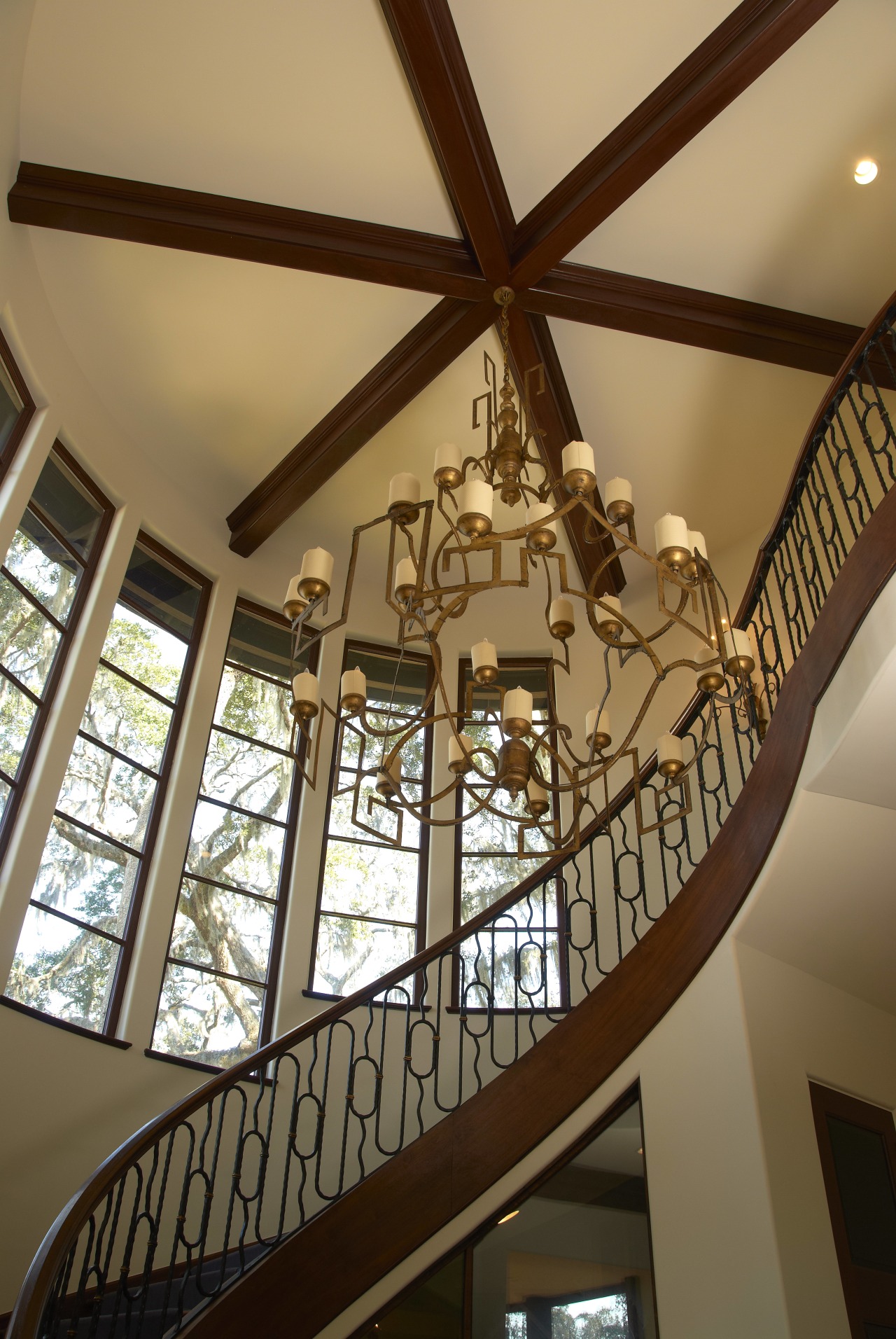 View of stairway. architecture, beam, ceiling, chandelier, daylighting, home, interior design, light fixture, lighting, stairs, structure, tourist attraction, window, wood, brown