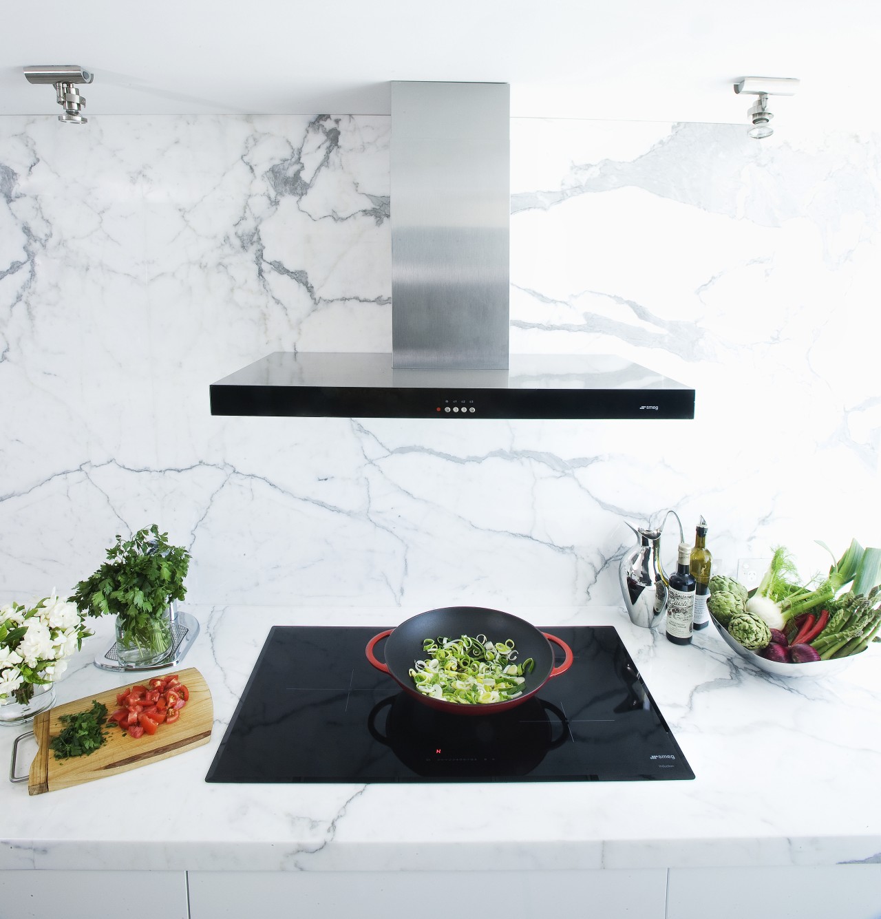 View of contemporary range and cooktop with wok. furniture, interior design, product design, table, white