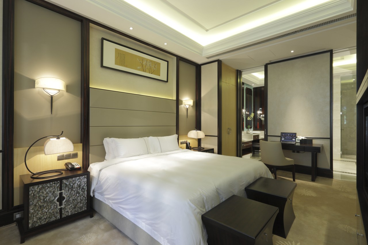 View of bed with white duvet. ceiling, hotel, interior design, room, suite, brown