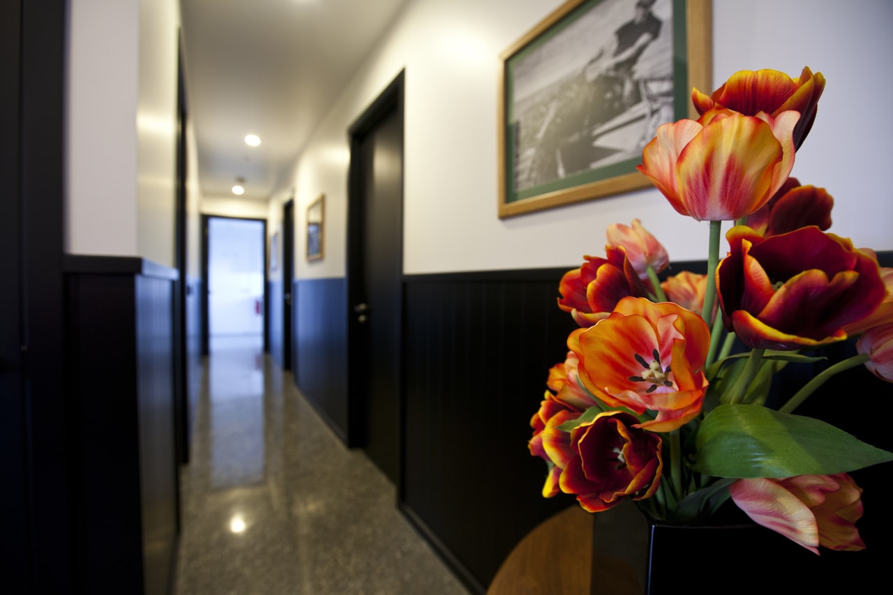 Hallway with black and white walls, grey flooring floral design, floristry, flower, flower arranging, interior design, plant, black, gray