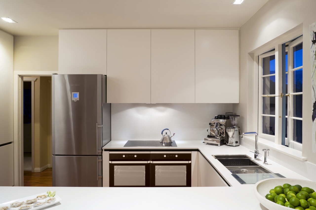 View of contemporary kitchen with white cabinetry and cabinetry, countertop, home appliance, interior design, kitchen, real estate, gray