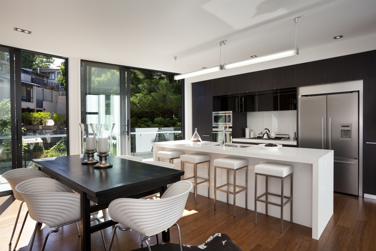 View of kitchen with white island and stools, architecture, countertop, house, interior design, kitchen, real estate, window, gray