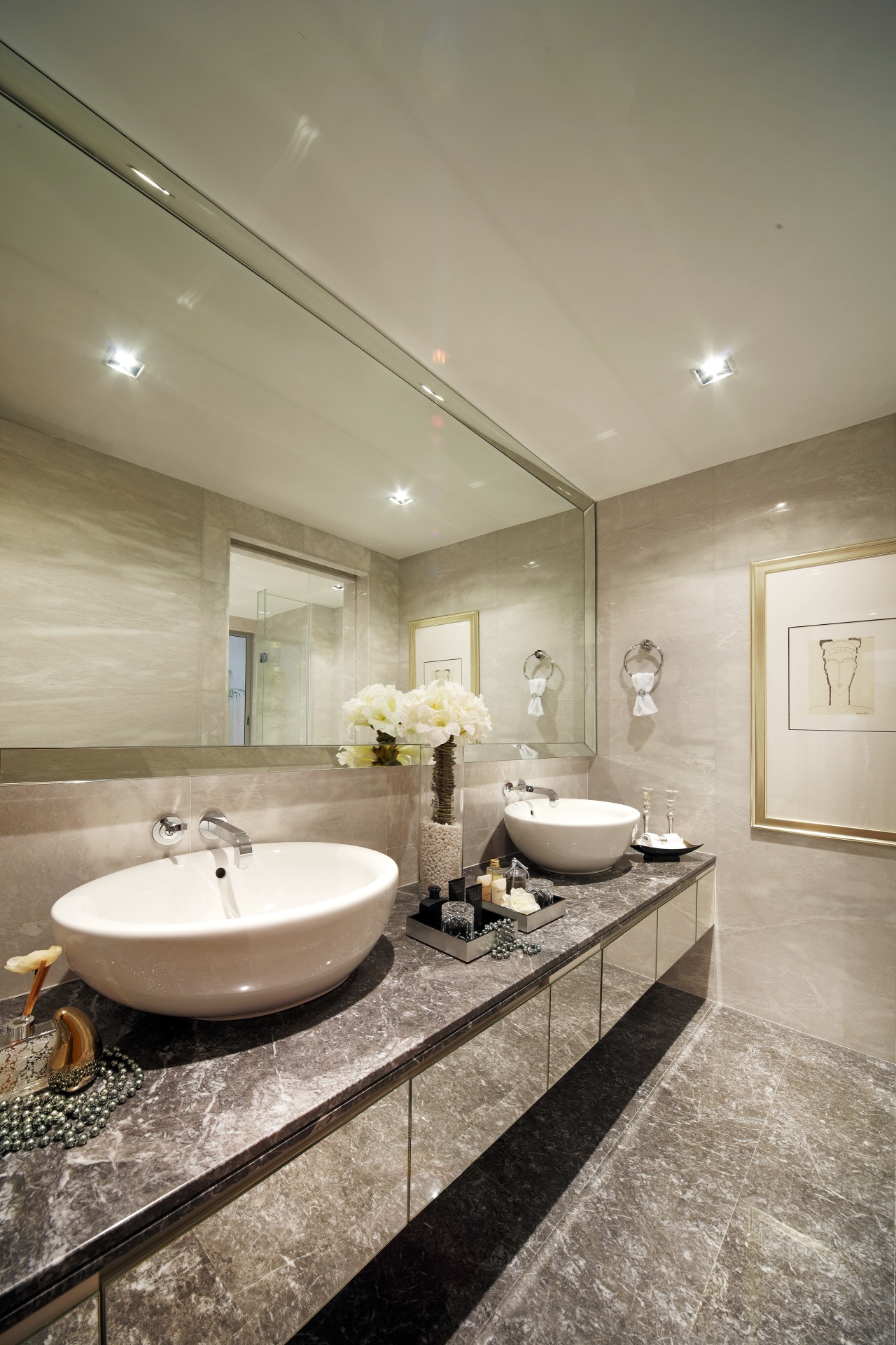 The mirror-fronted vanity in this glamorous suite continues bathroom, ceiling, estate, floor, home, interior design, real estate, room, sink, orange, brown
