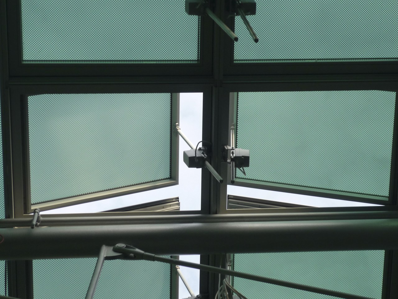 Close up detail of window system. daylighting, glass, shade, window, teal, black