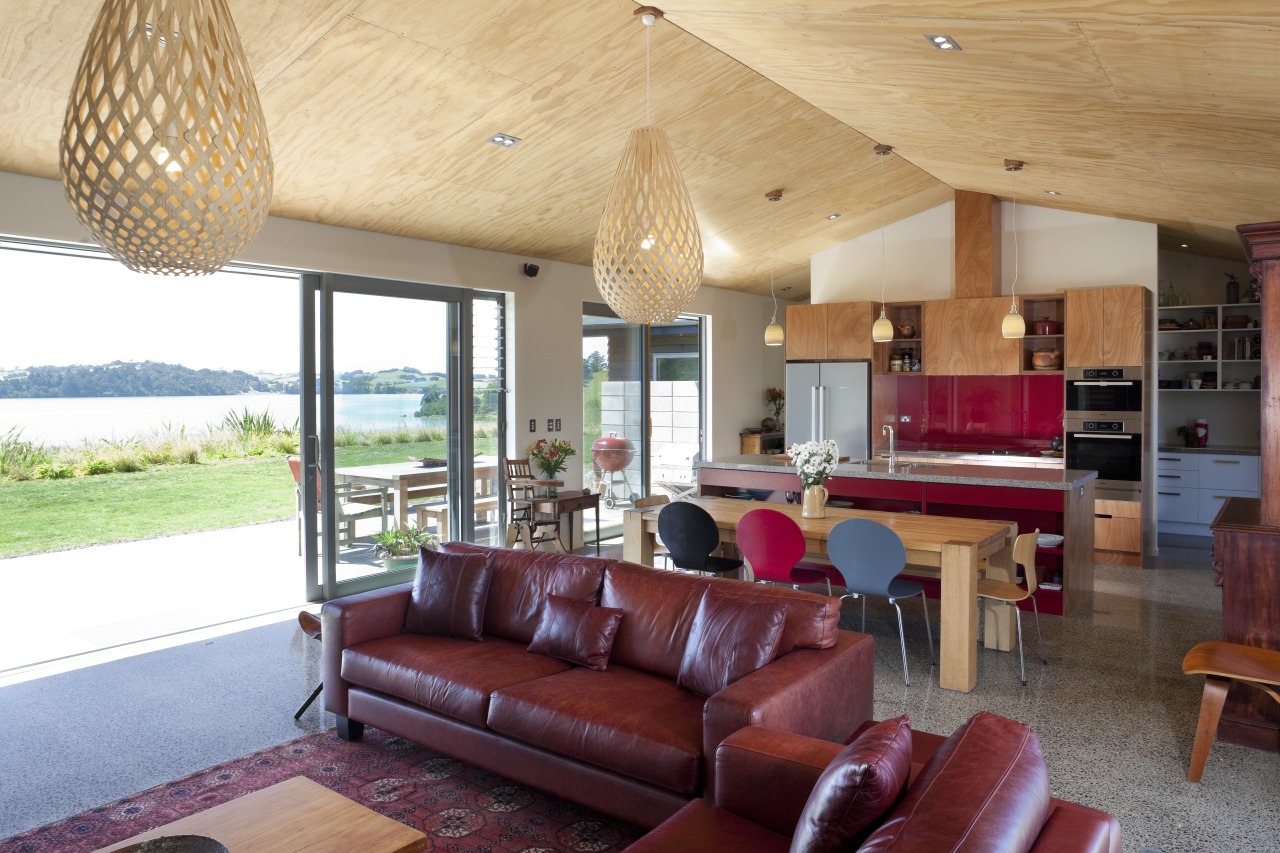 Lounge with red leather couches and hanging light ceiling, estate, home, house, interior design, living room, property, real estate, room, window, orange