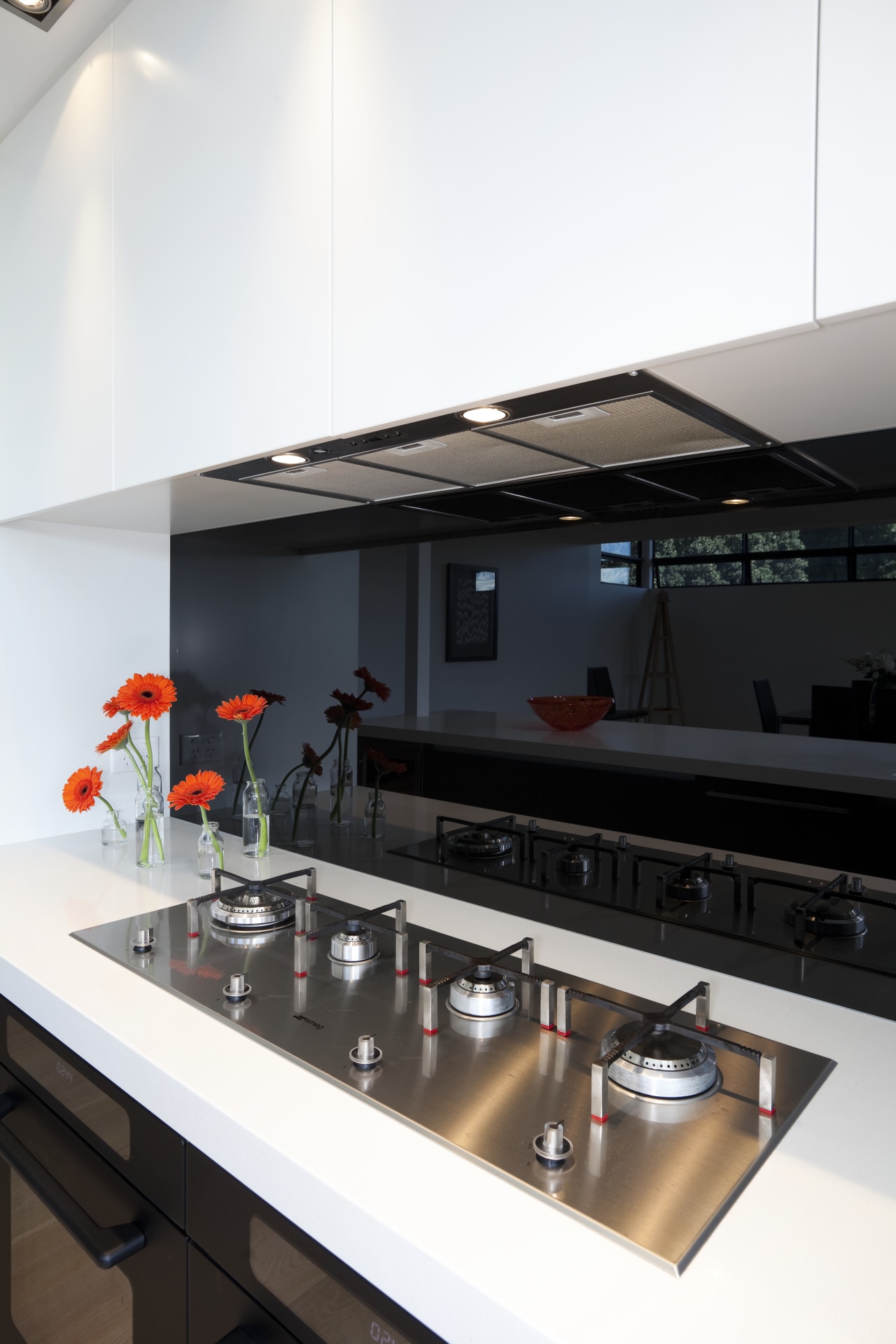 View of kitchen with white cupboards, black splashback countertop, interior design, kitchen, product design, white, black